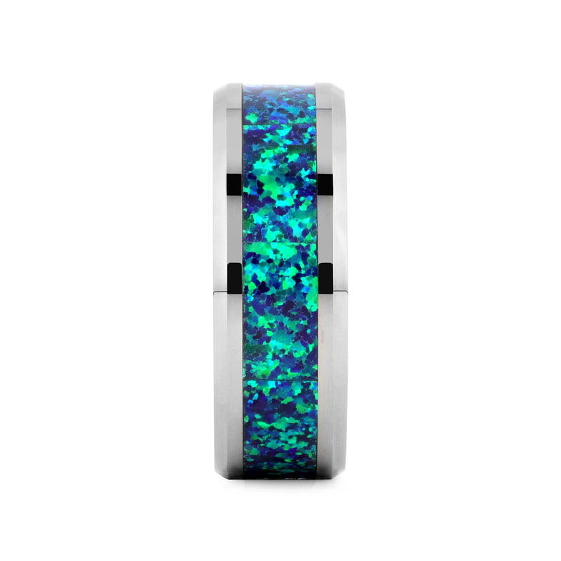 Tungsten carbide ring with blue opal inlay on a white background