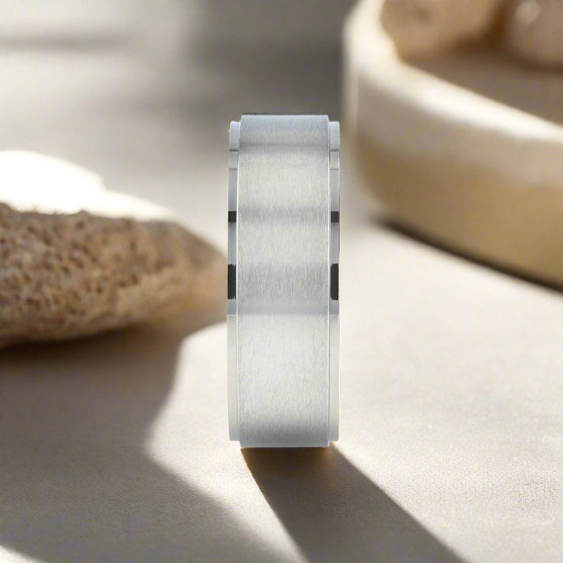 Shu titanium ring with brushed raised center, front view