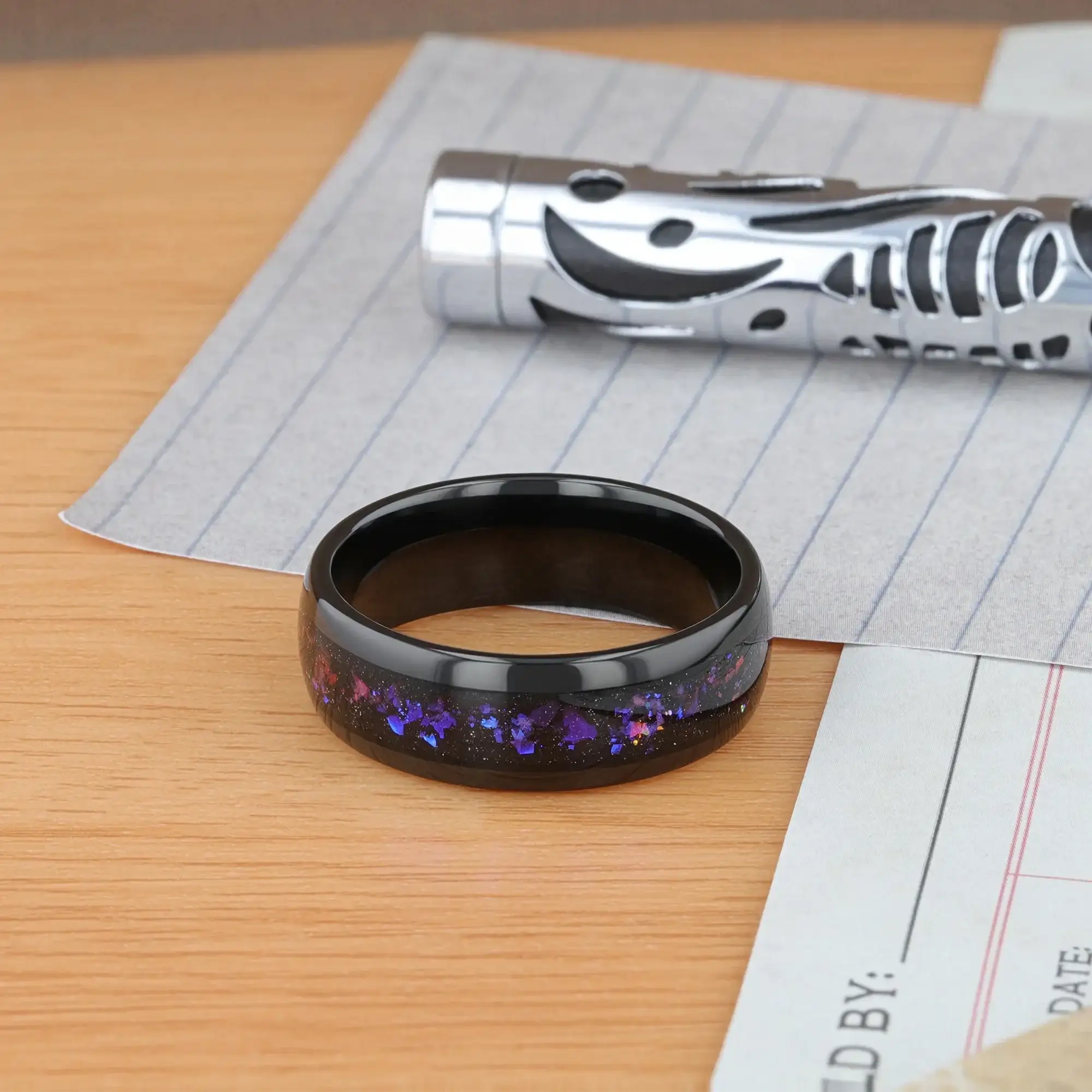 Naxos black tungsten alexandrite ring, worn on hand