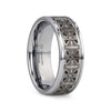 Tungsten carbide ring with intricate design on a white background