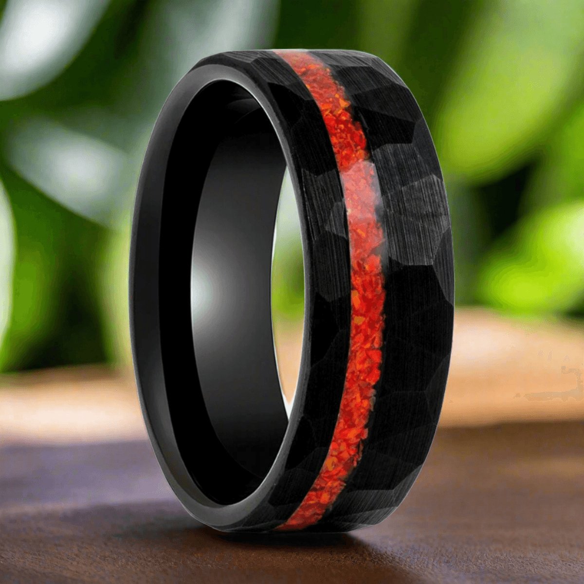 Nefertem black tungsten ring with orange opal inlay, front view
