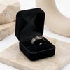 Galileo black tungsten wedding band presented in a black gift box