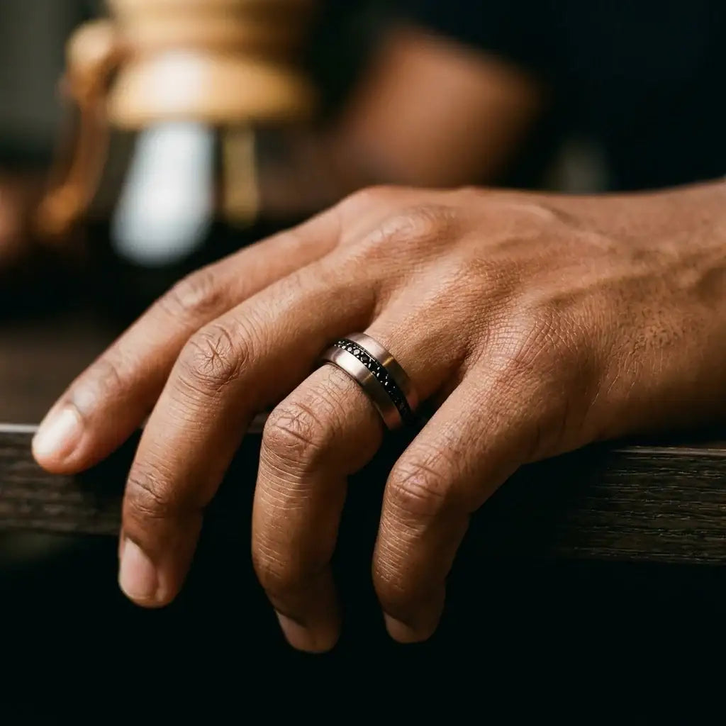 Ramses espresso tungsten carbide ring photographed in a lifestyle setting