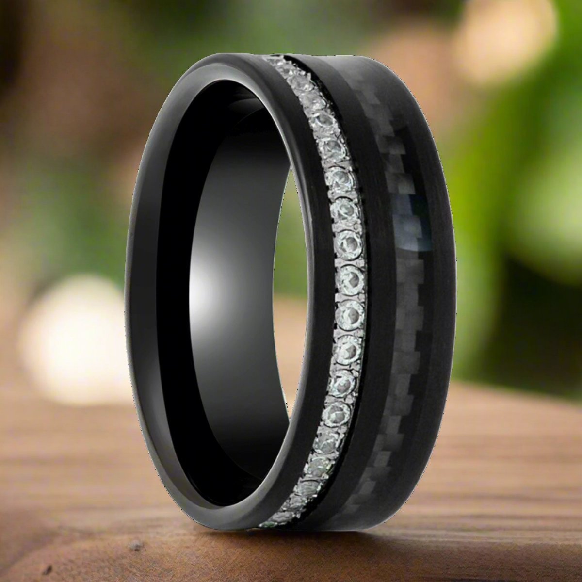 Anhur black tungsten ring with carbon fiber and white CZ eternity, front view