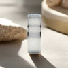 Shu titanium ring with brushed raised center, side view