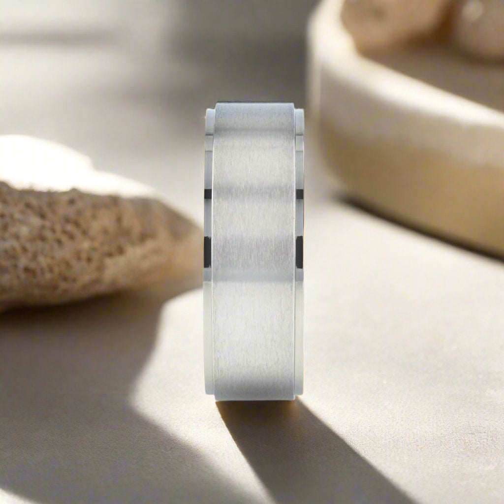 Shu titanium ring with brushed raised center, side view