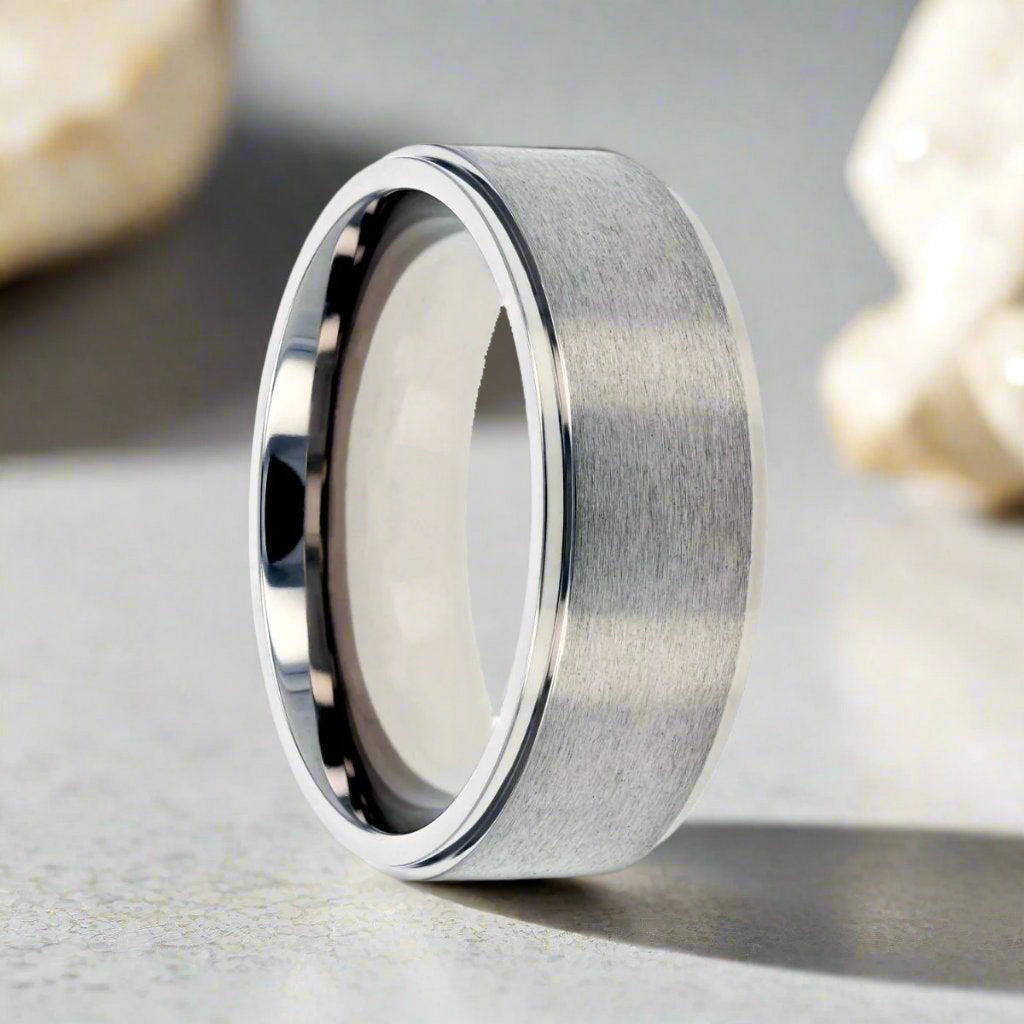 Shu titanium ring with brushed raised center, front view